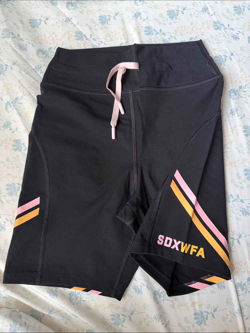 White Fox Boutique Black Bike Shorts with Pink & Gold Stripe Accents